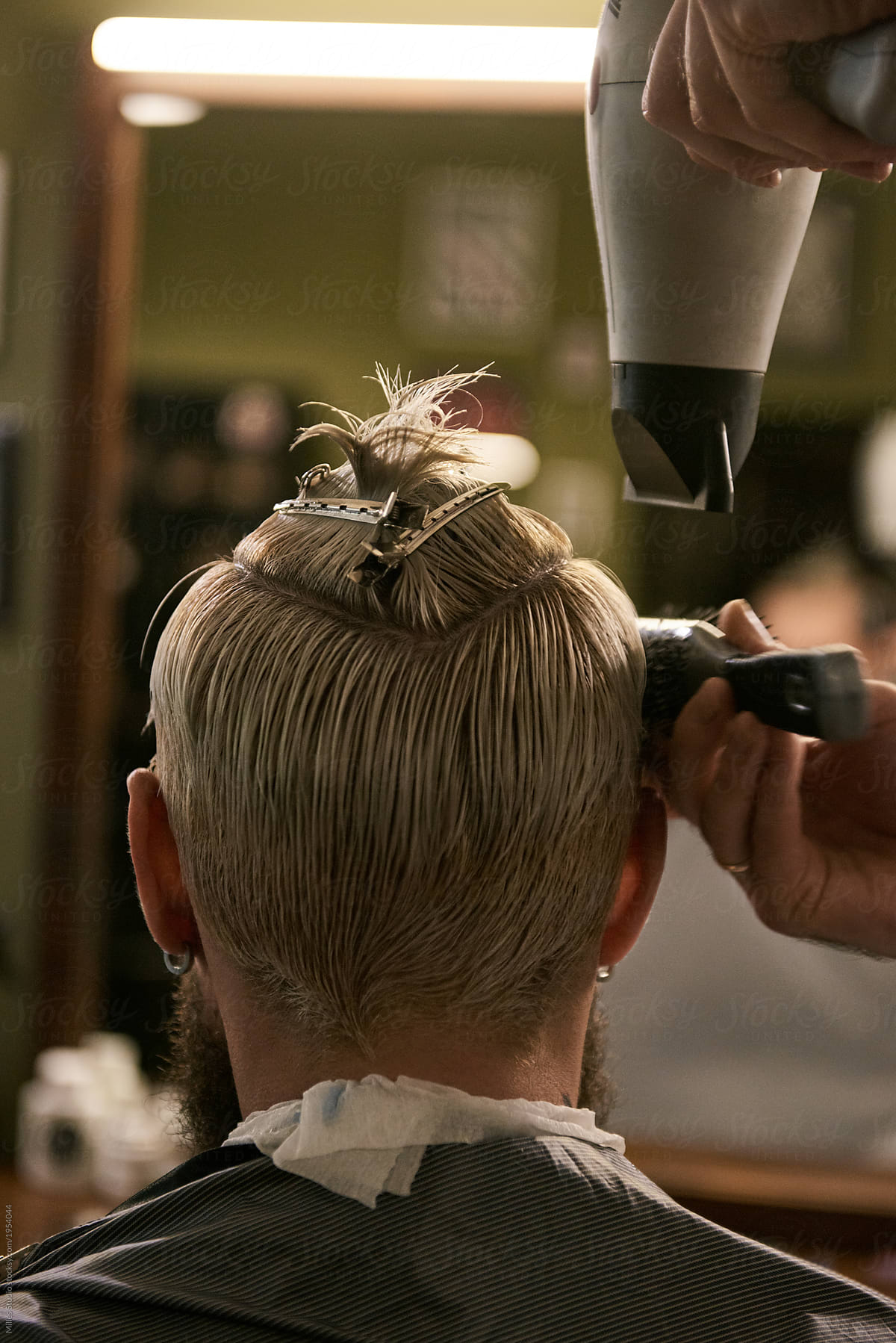Close-up of barber drying hair