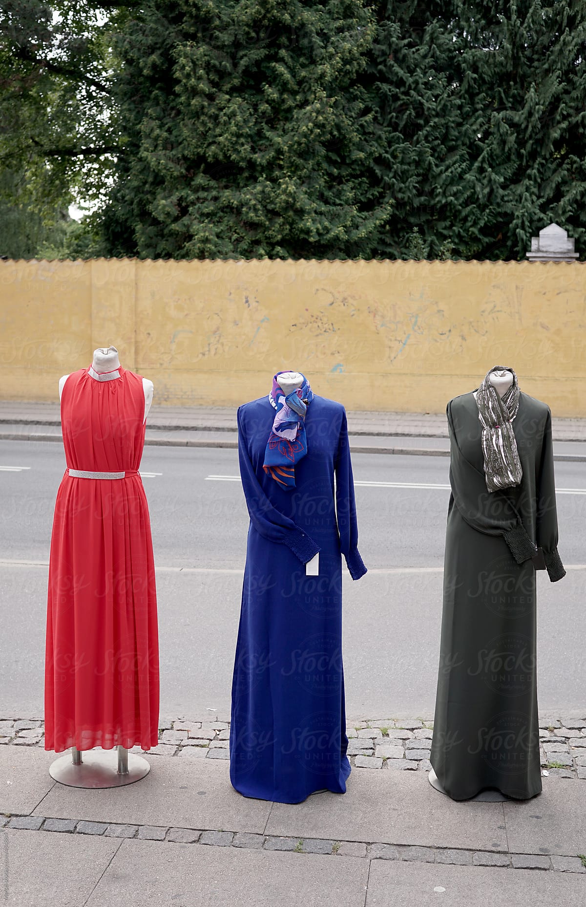 Three mannequins in arab dresses, out on the pavement in Copenhagen