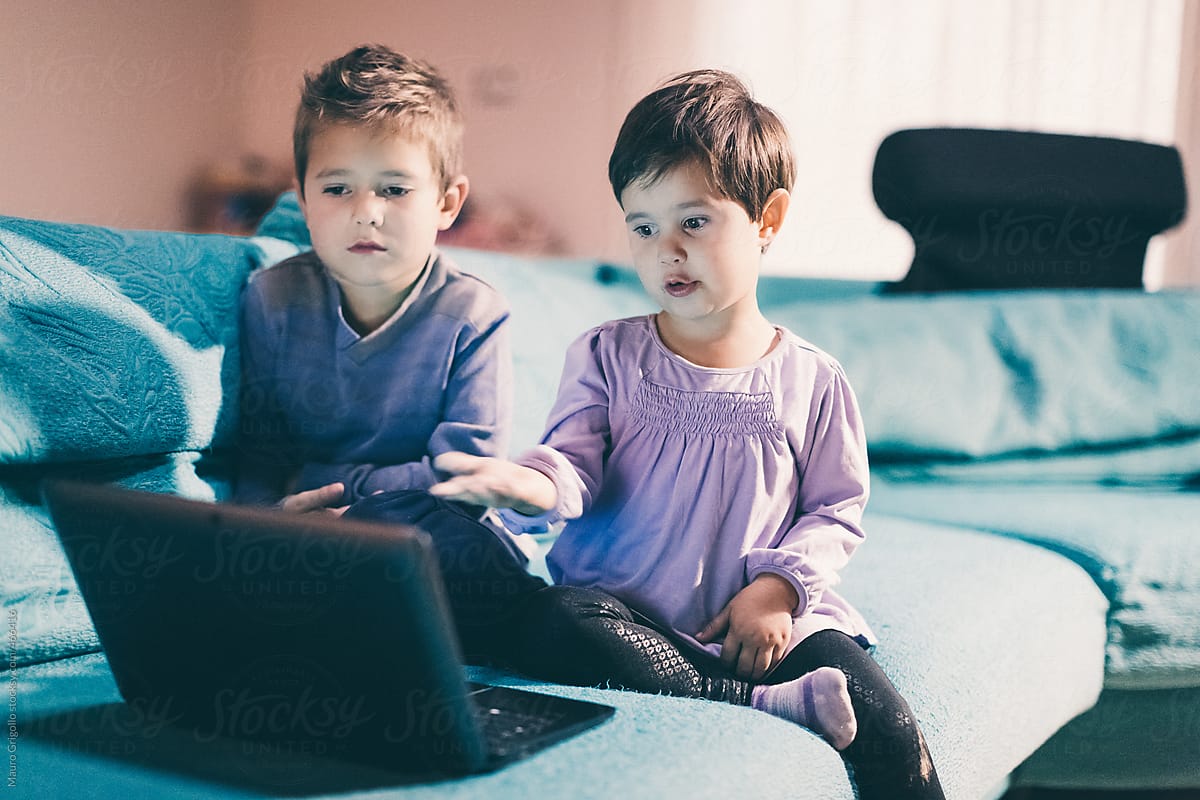 Children using a laptop without parental control