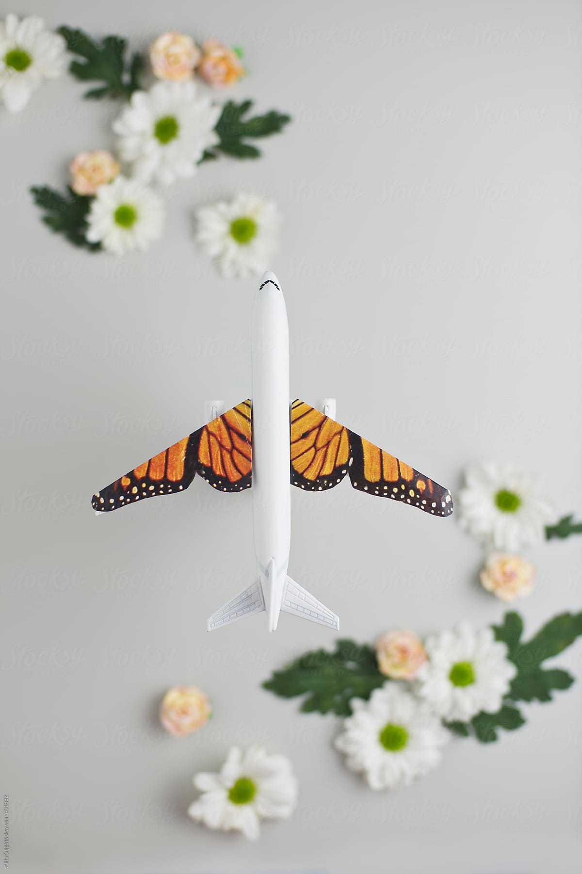Flight with butterfly wings flying over flowers