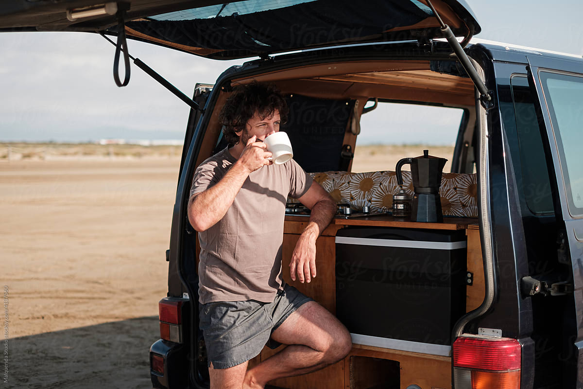 Man having breakfast in camper van