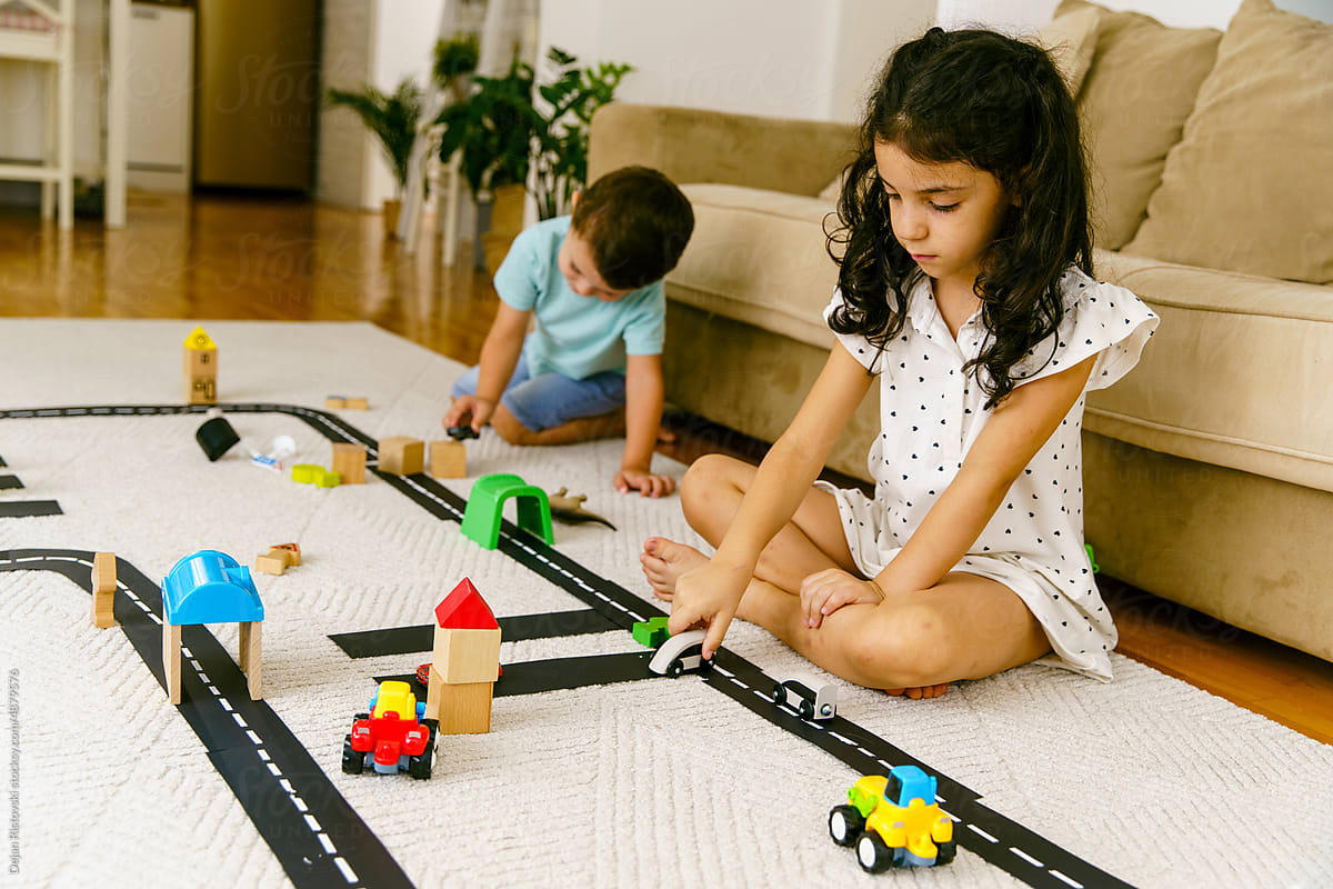 Children playing and learning traffic at home