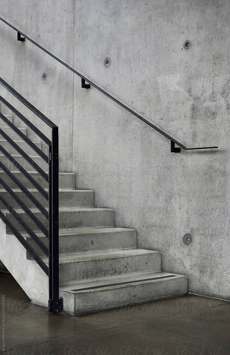 Shabby concrete stairway near wall