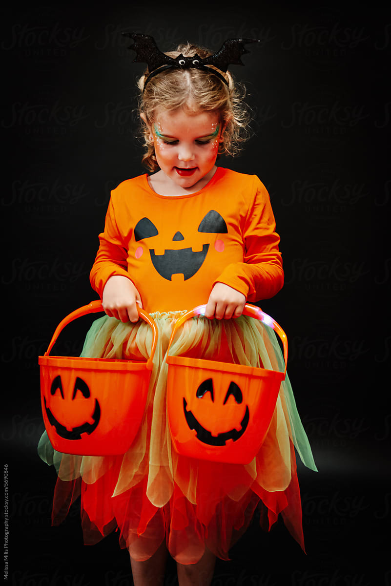 Little girl ready for trick-or-treating on Halloween