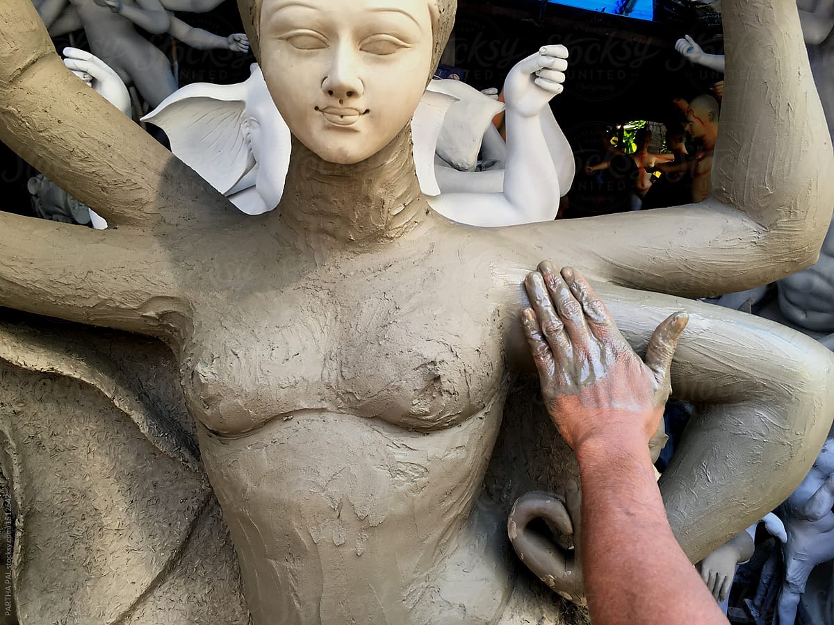 A man applied mud to Goddess Durga,the Hindu religion