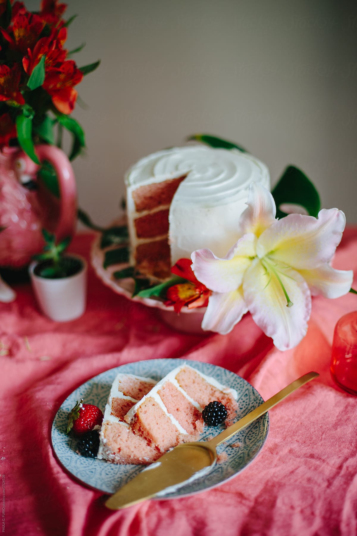 Pink cheesecake with fruits and flowers