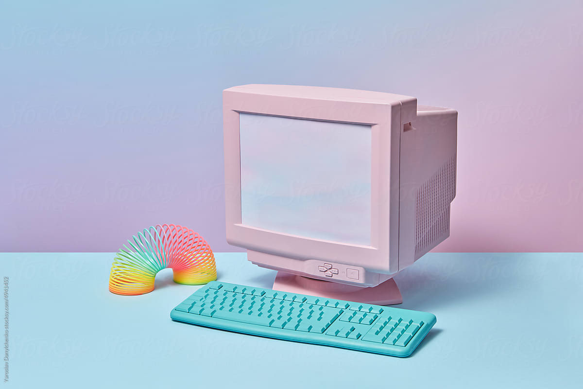 Retro computer with keyboard and spring toy.