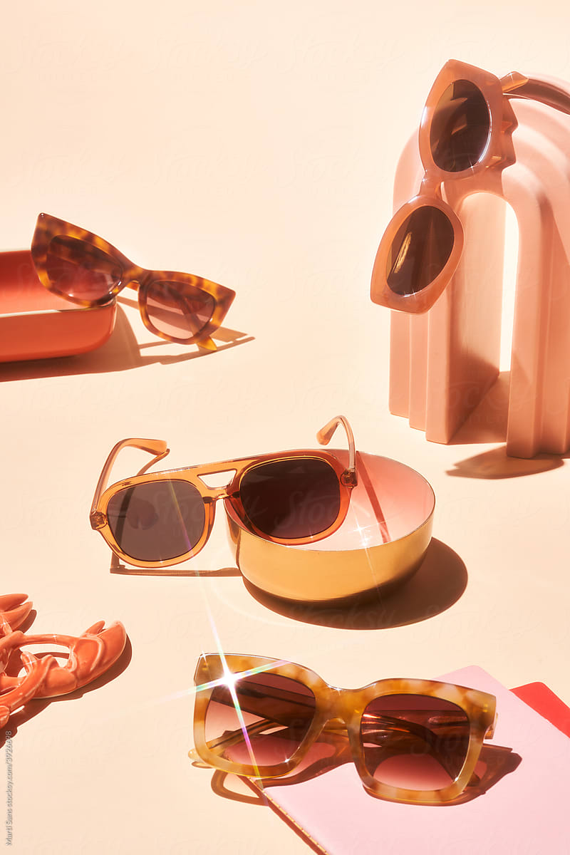 Composition of shiny sunglasses and decorations