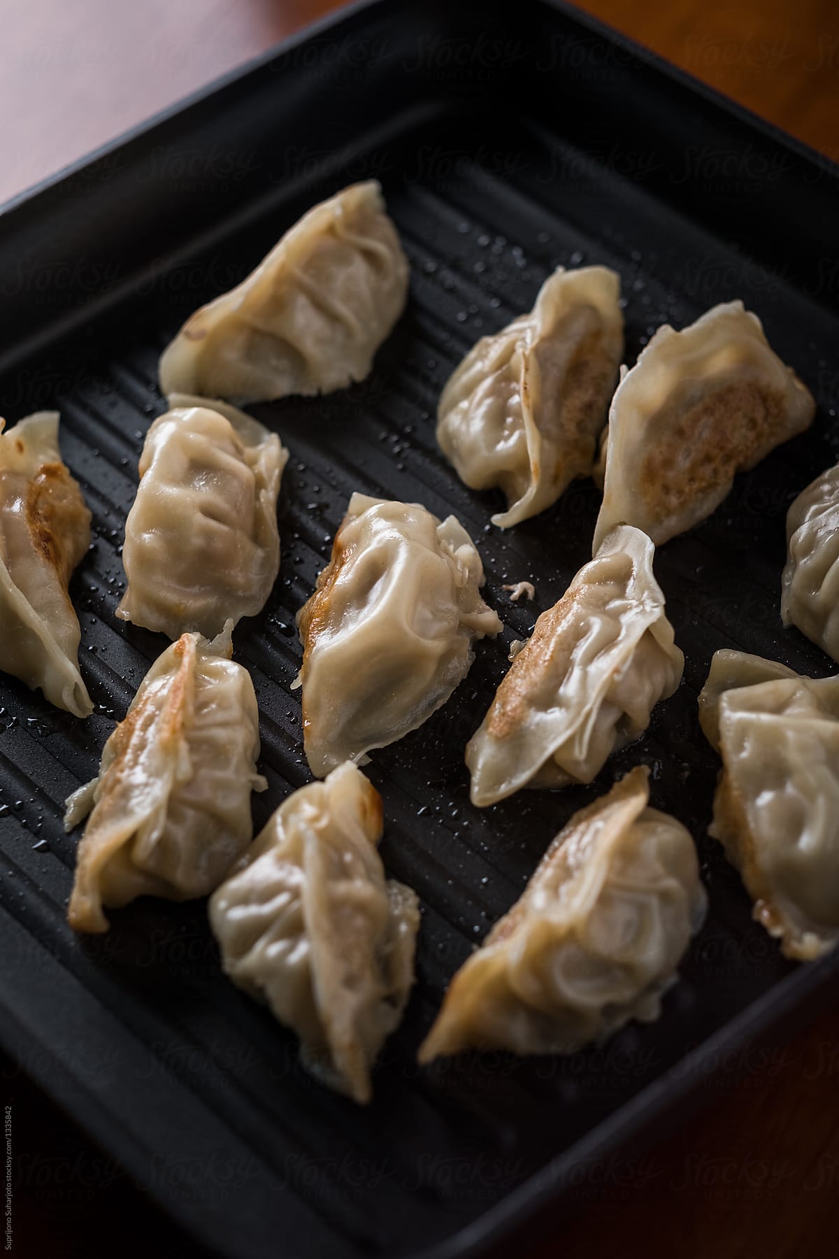 Chinese food pot stickers  in a pan