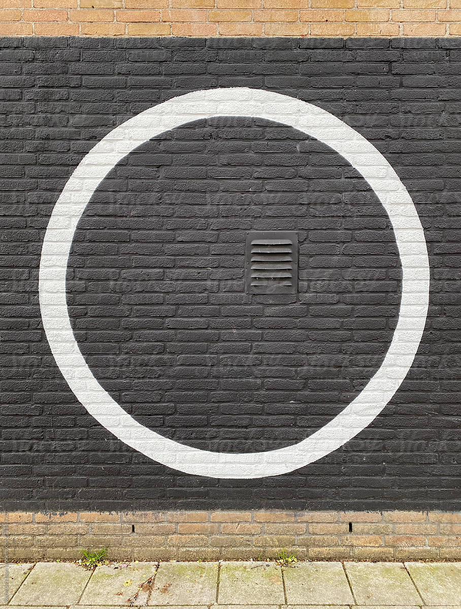 black brick wall with big circle