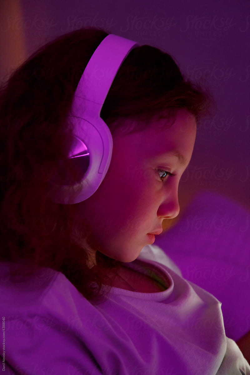Child listening to music at night