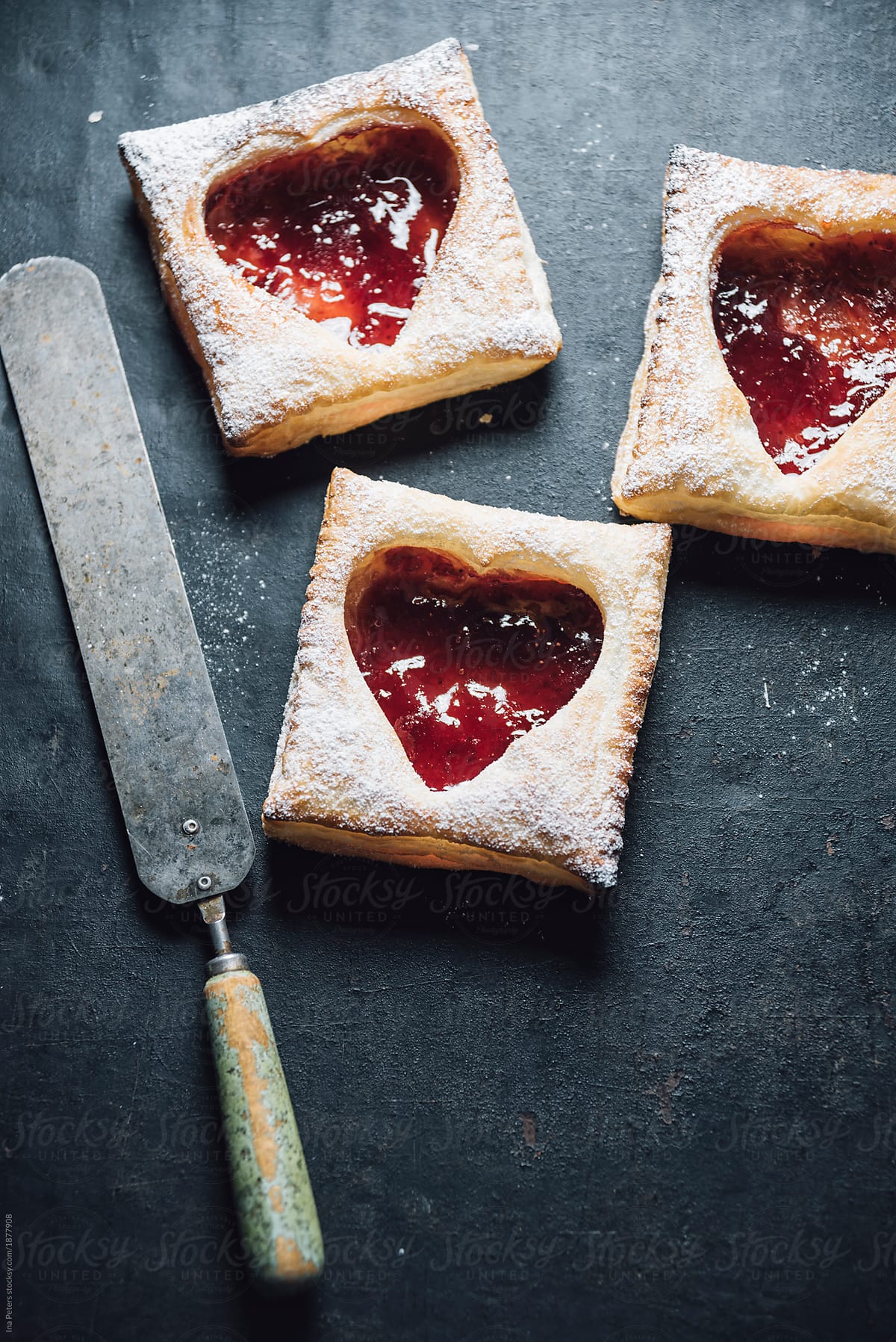 Food: little puff pastry with strawberry jam filling, heart shap