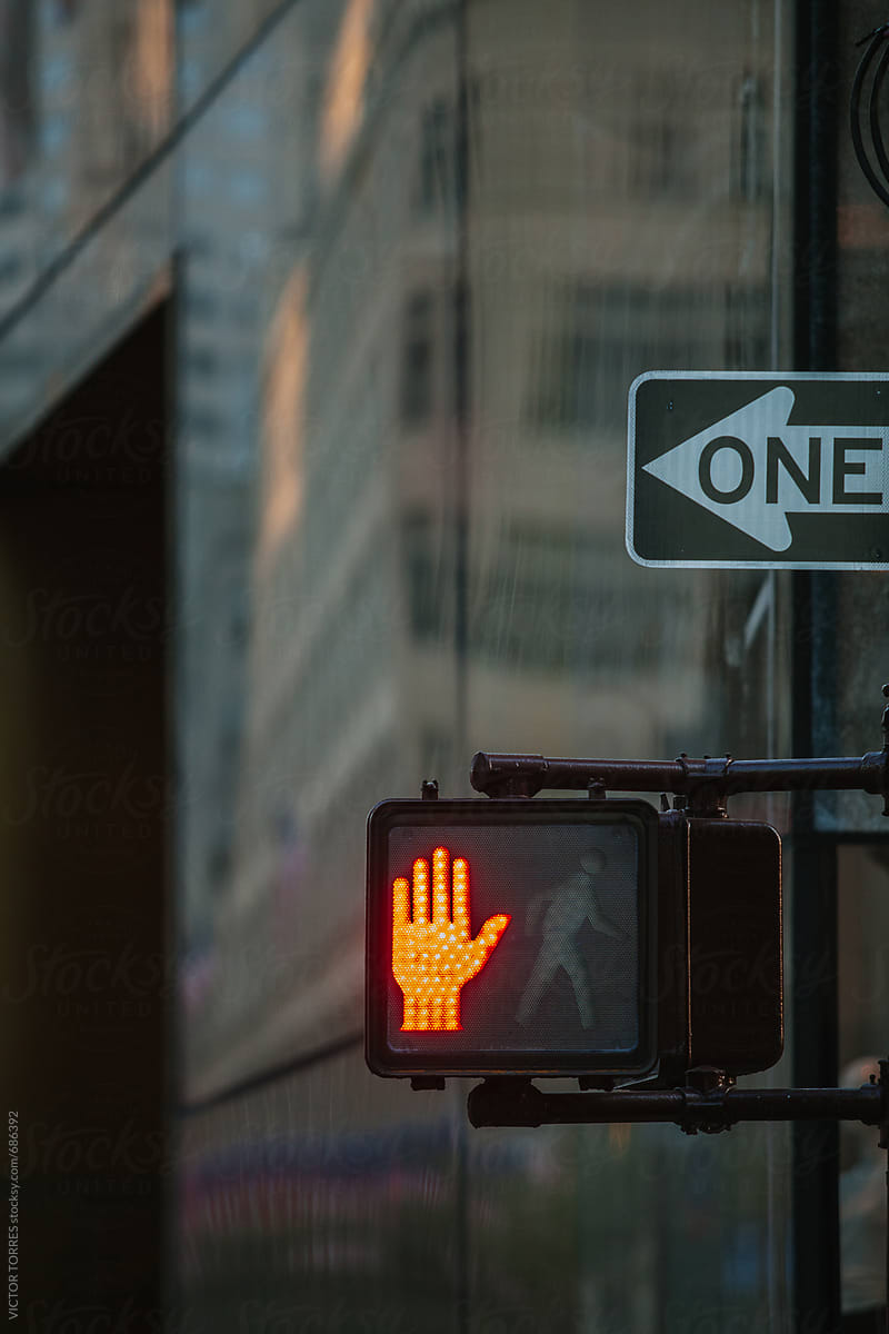 Red Hand Symbol In A Manhattan Traffic Light, New York by VICTOR TORRES