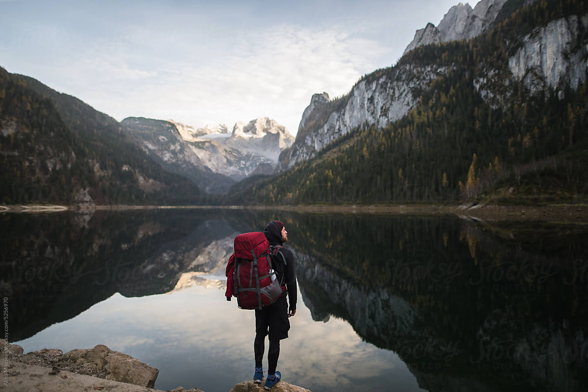 Backpacker enjoying alpine lake