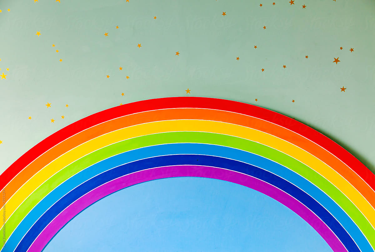 Detail of a rainbow-themed bed