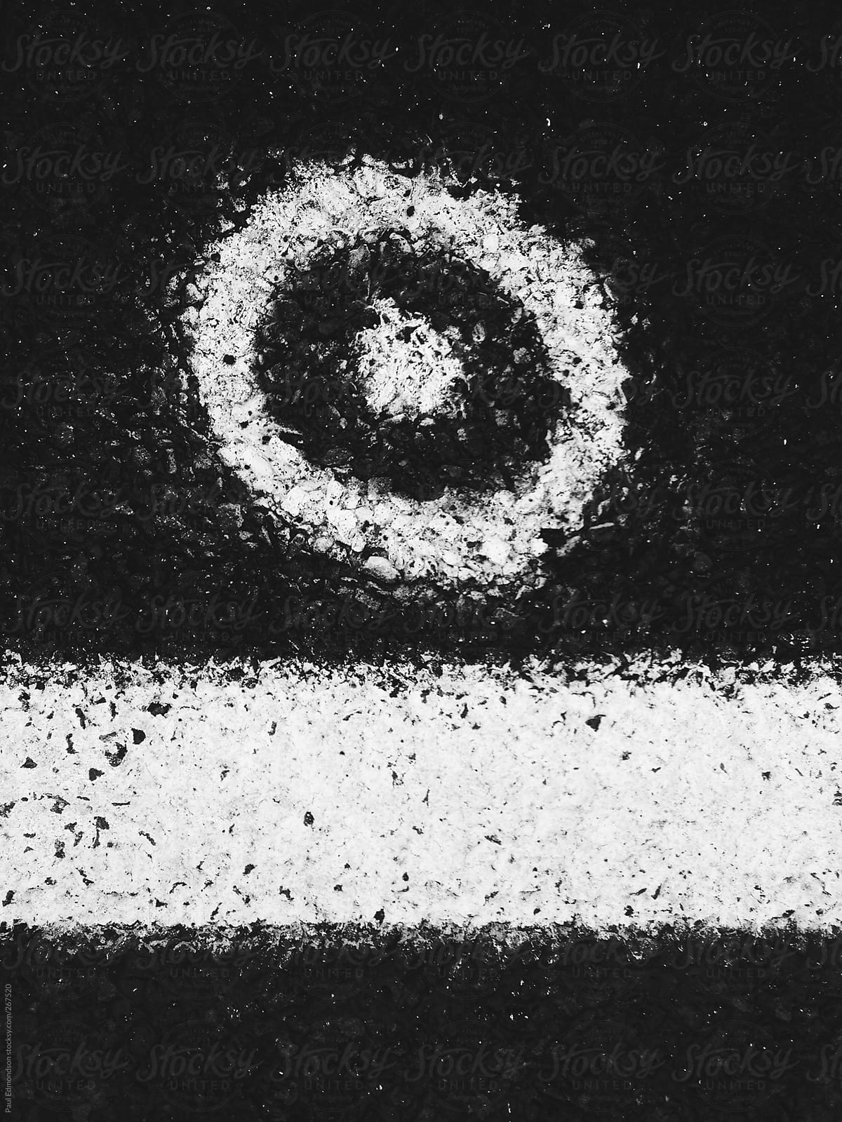 White paint markings  on road pavement, close up