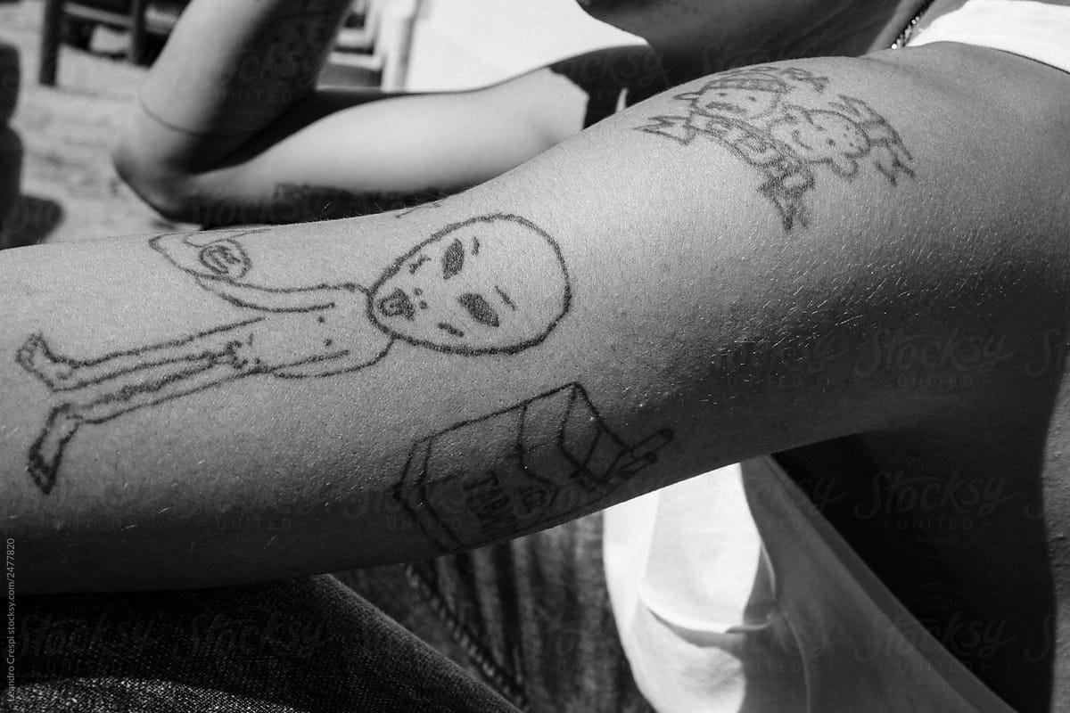 Extraterrestrial tattoo in arm detail black and white