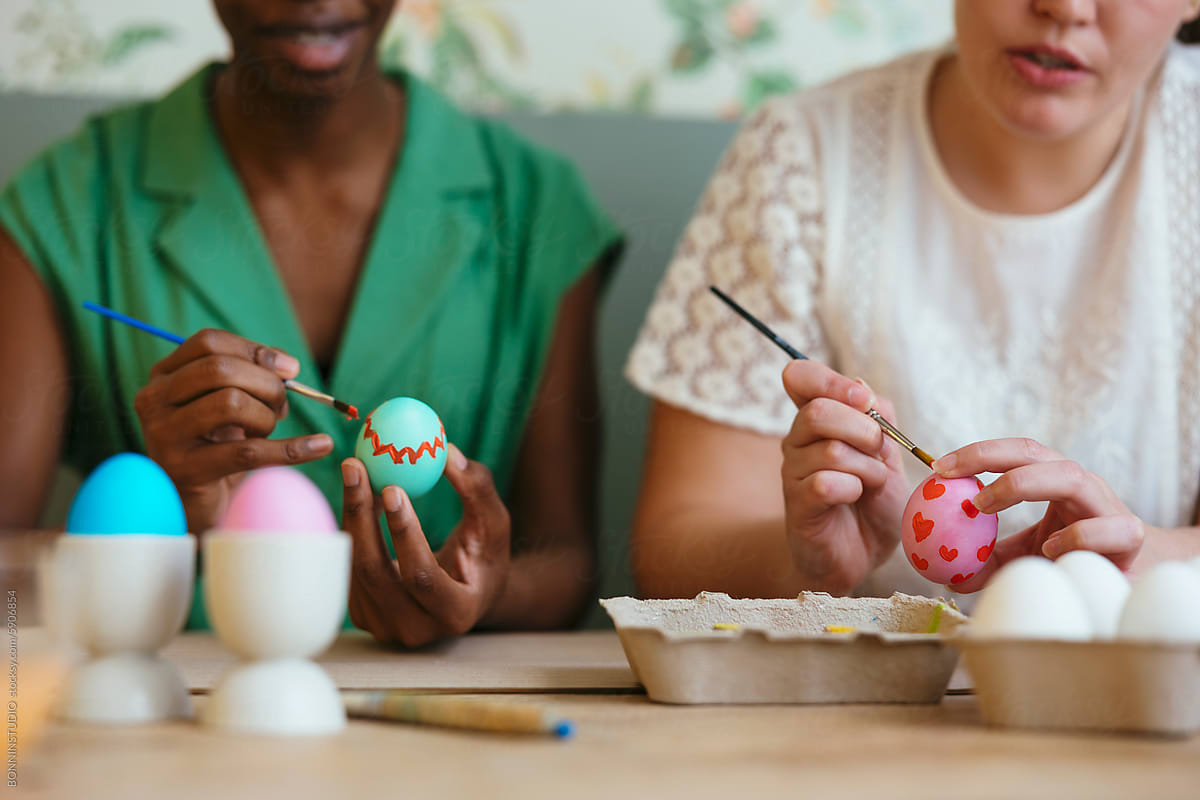 Female friends preparing eggs for Easter