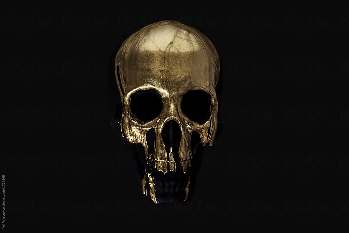 Gold paint running down black skull