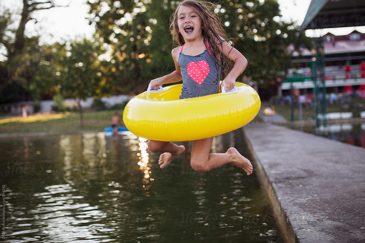Girl Playing Jumping In Lake By Dejan Ristovski