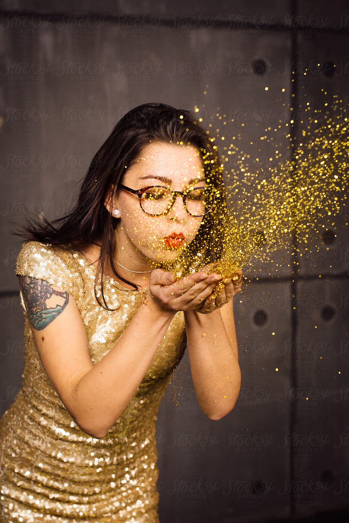 Girl Blowing Glitters Out Of Hands By Stocksy Contributor Andrey 