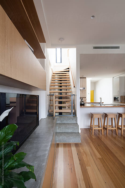 Modern conversion in loft apartment with timber stairs leading t