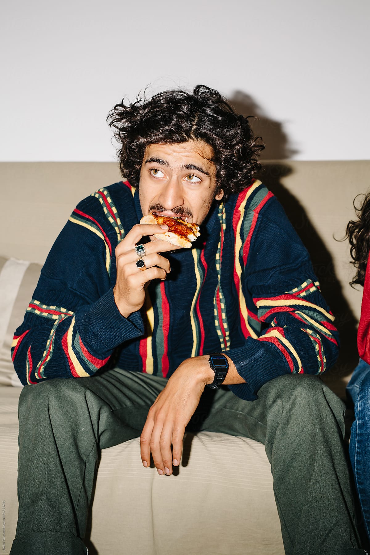 Man sitting and eating pizza