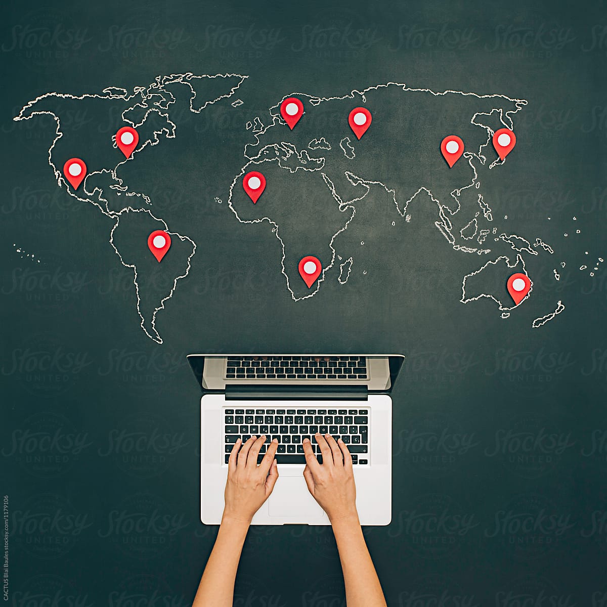 Internet search with notebook. World map on chalkboard with pins.