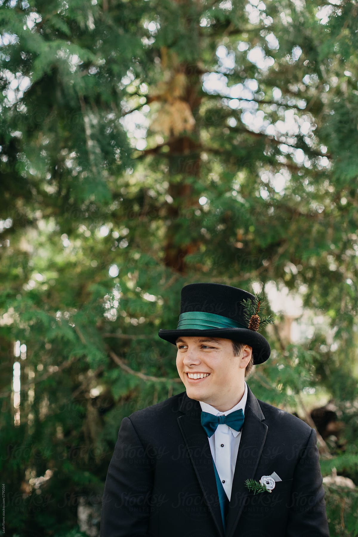 Portrait of Happy Groom in Forest with Top Hat and Bowtie