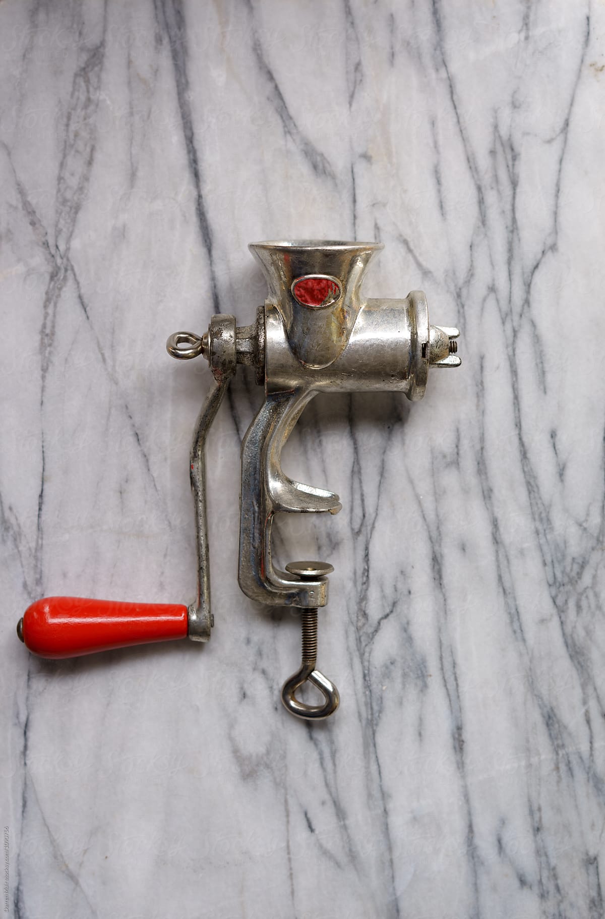 Meat mincer on marble background.