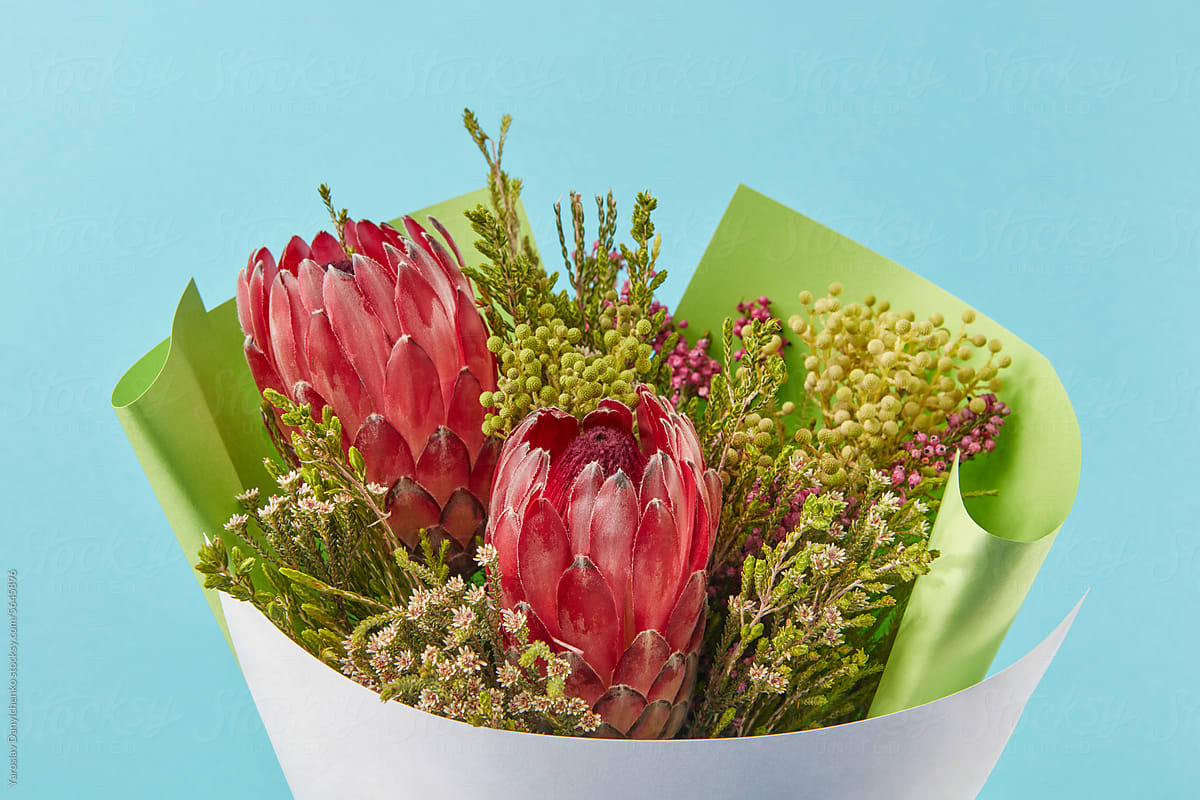 Beautiful bouquet with red proteas and various wild flowers