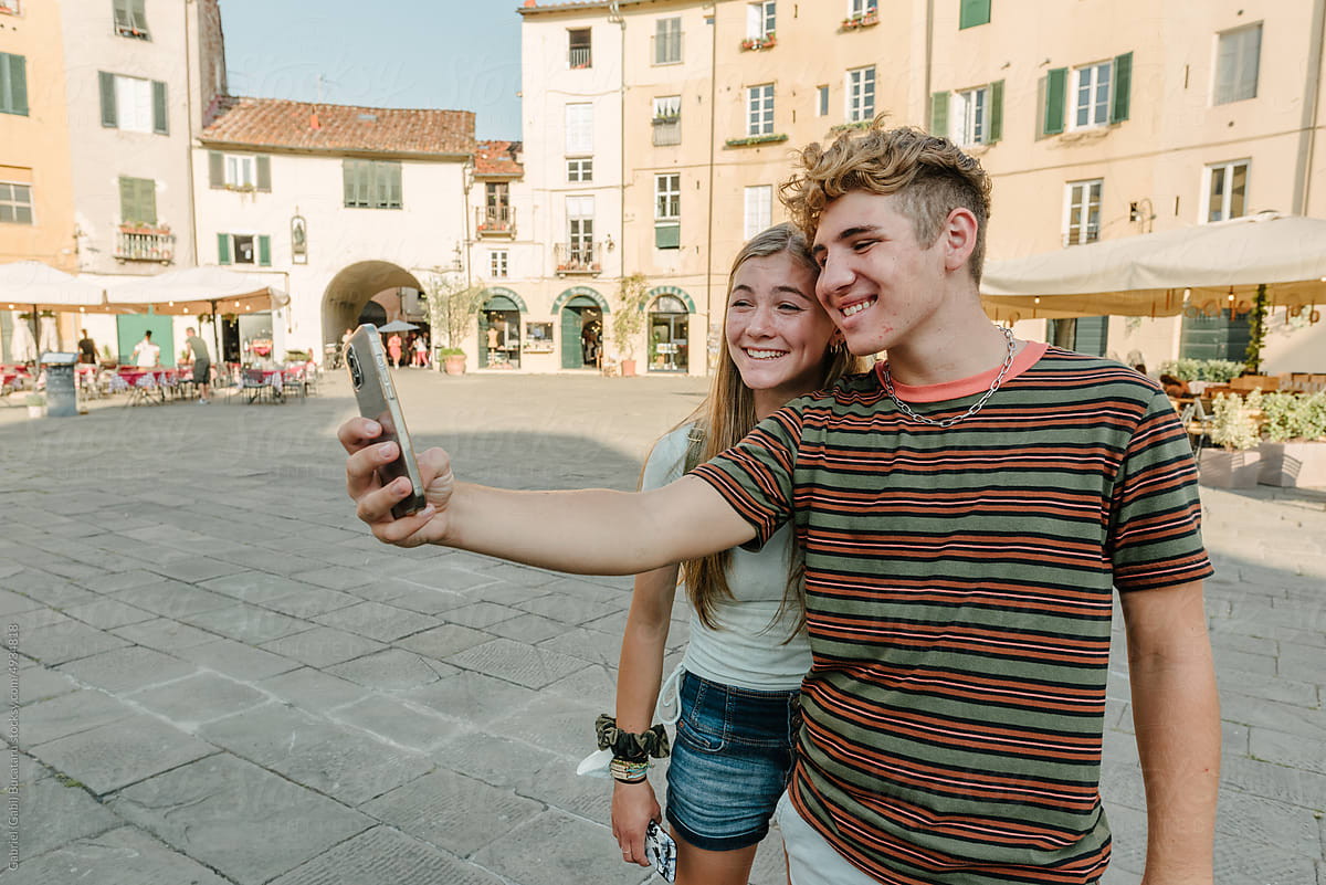 Teen boy and girl taking selfie