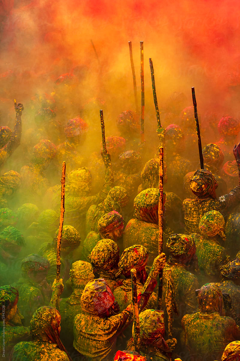 People gather in holi festival, colourful powder in air