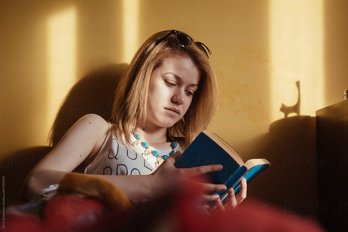 Blonde Girl Reading A Book By Stocksy Contributor Boris Jovanovic