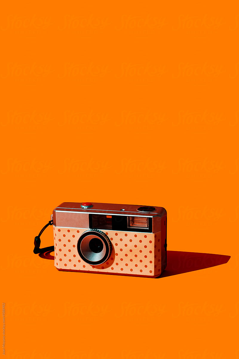 self-customized analog camera on an orange background