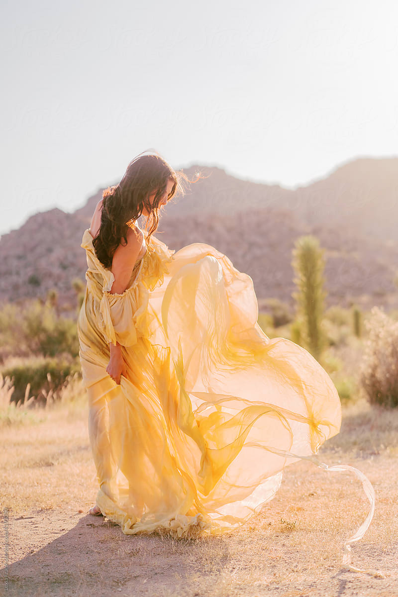 photoshoot in the desert with yellow dress