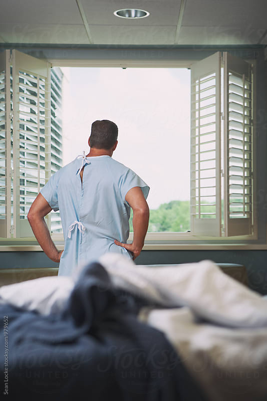 Hospital: Male Patient Looks Out Window With Hope