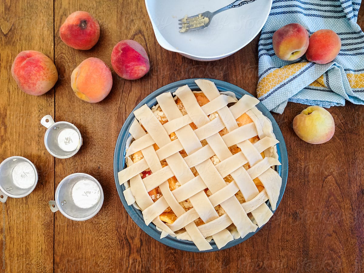 Homemade peach pie on table top