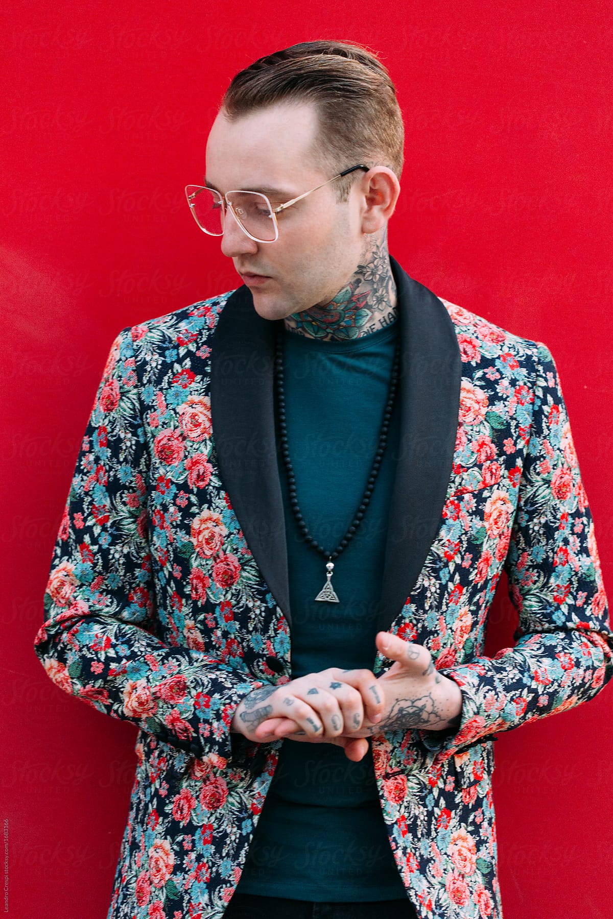 «Tattooed Handsome Man With Colourful Flower Jacket Over Red Background ...