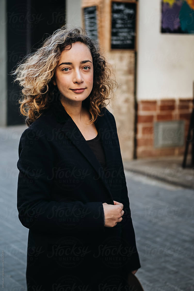 Portrait Of A Woman With Curly Hair By Stocksy Contributor Vera Lair Stocksy