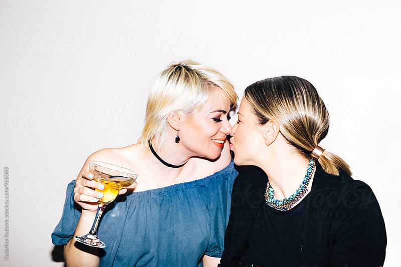 Two Pretty Friends Drinking Champagne