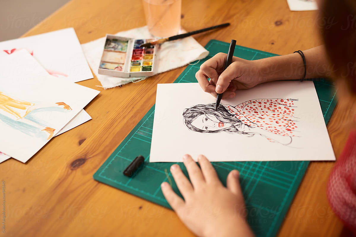 Child drawing on paper.
