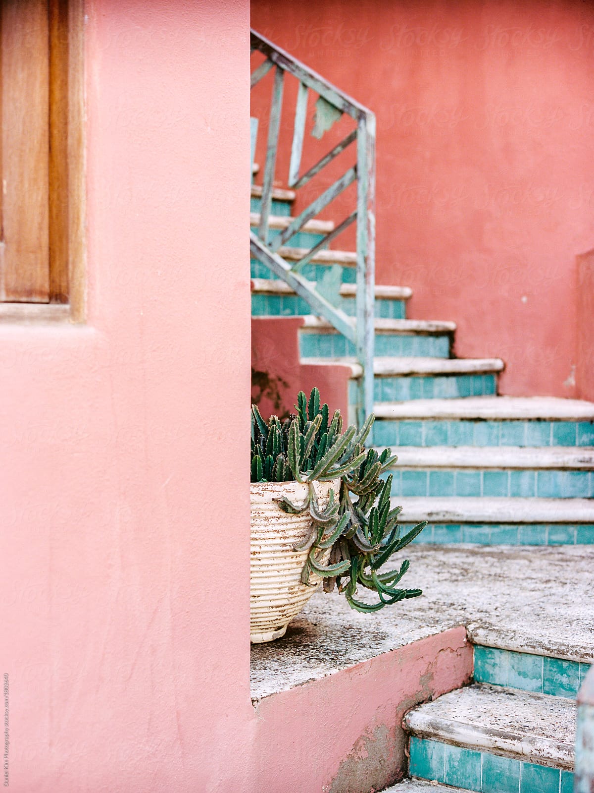 Pastel blue steps against pink building