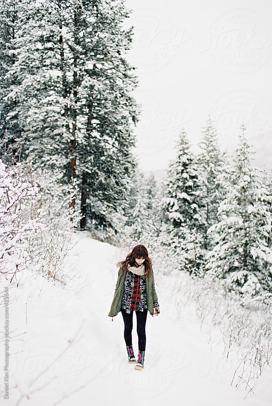 Brunette girl standing in snow by Daniel Kim Photography - Stocksy United