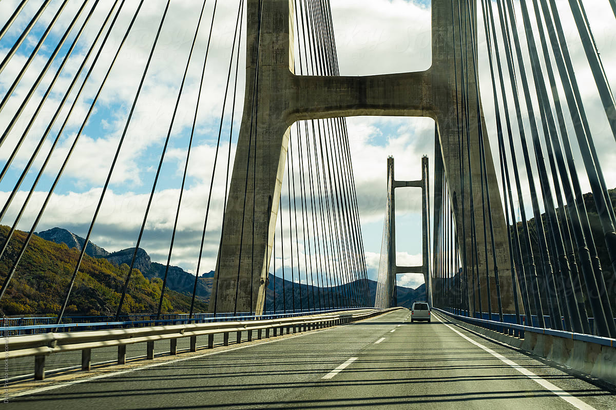 Majestic bridge spanning mountainous landscape in Asturias, Spain