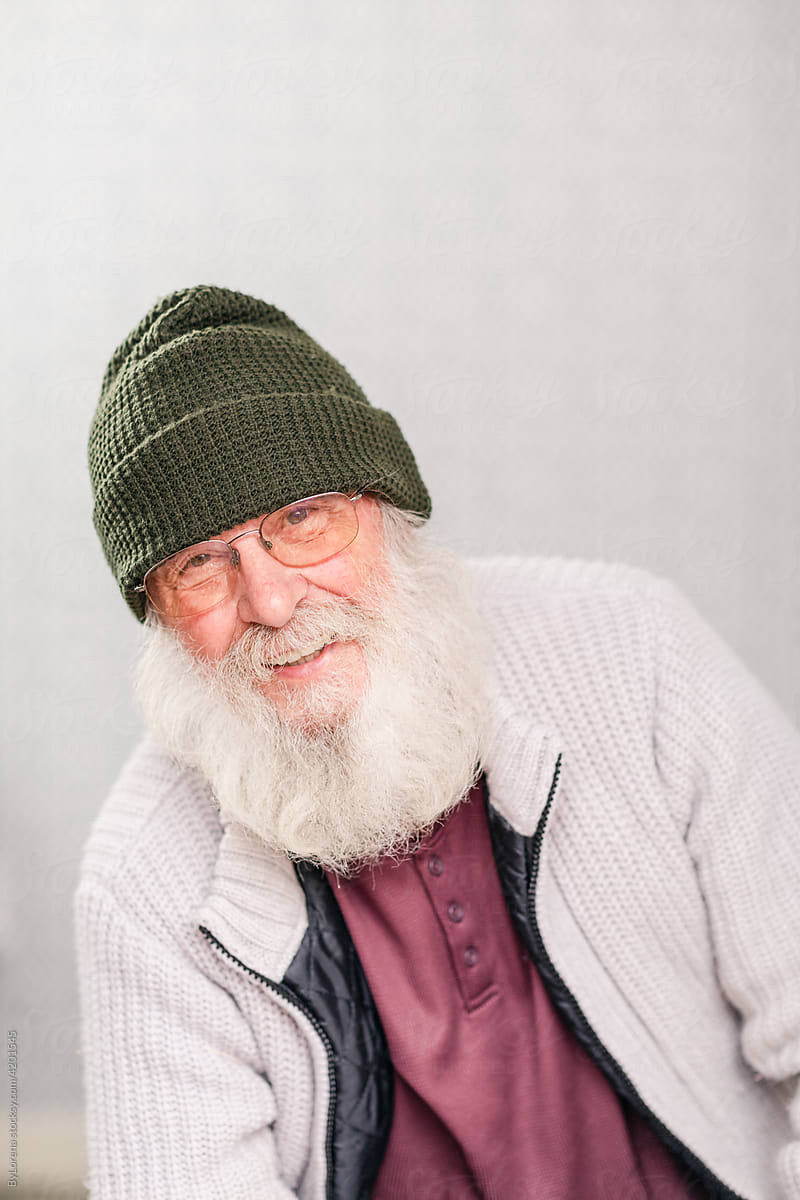 Gray-haired bearded man in warm clothes