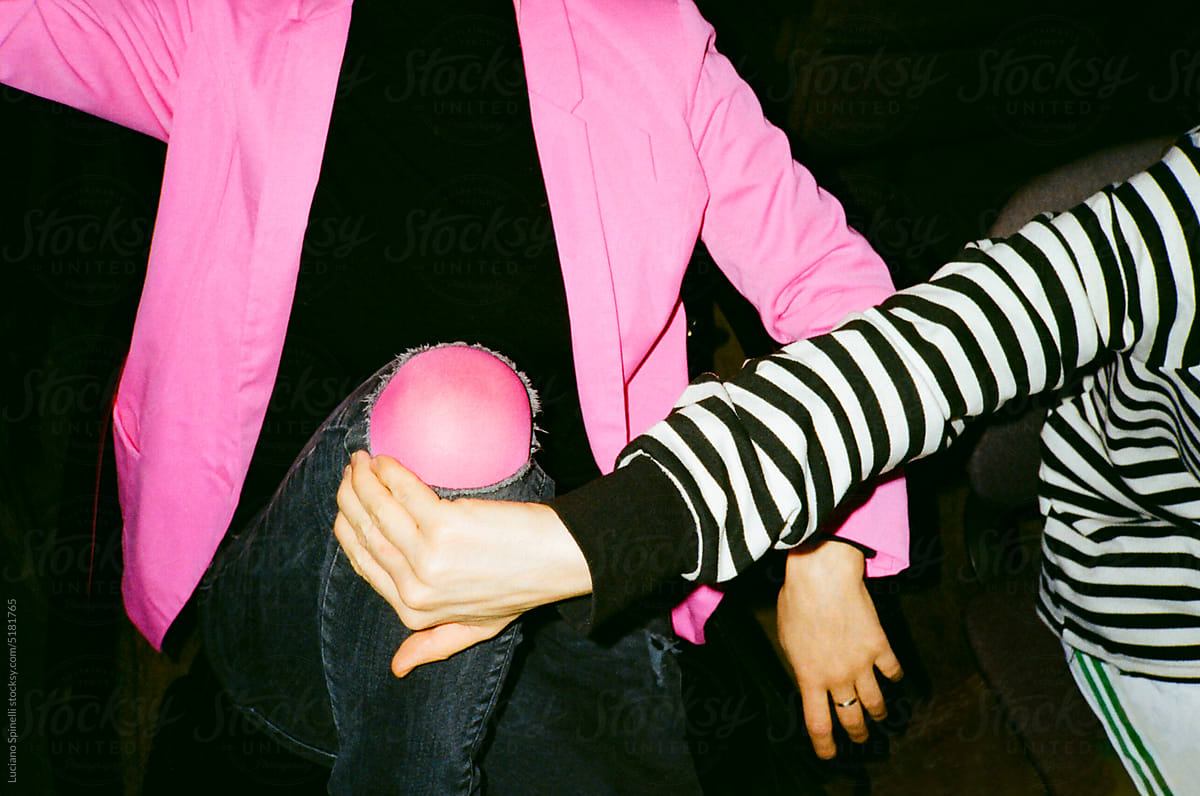 "Anonymous person in matching pink tights and blazer" by Stocksy Contributor "Luciano Spinelli"