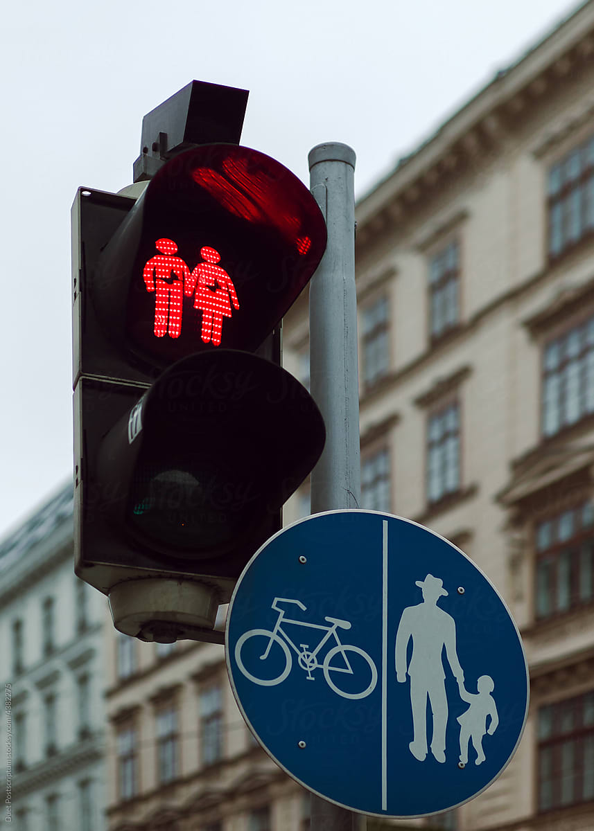 Traffic Light with a loving couple Holding Hands