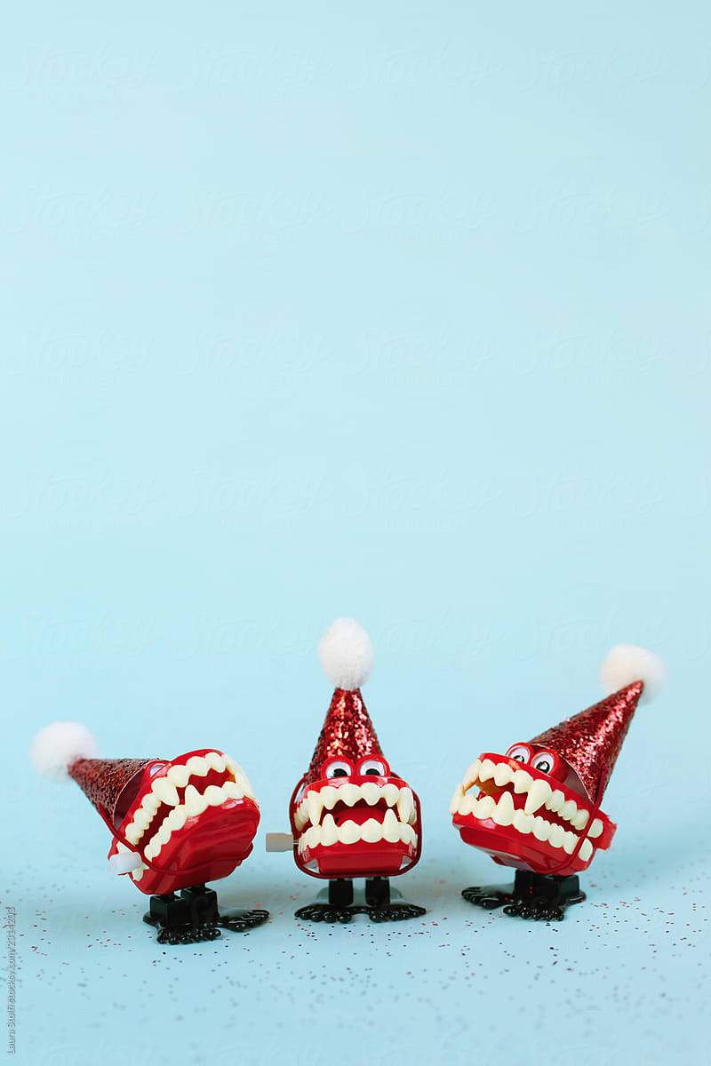 Funny vampire teeth toys carol singers wearing glittery with santa claus hats on