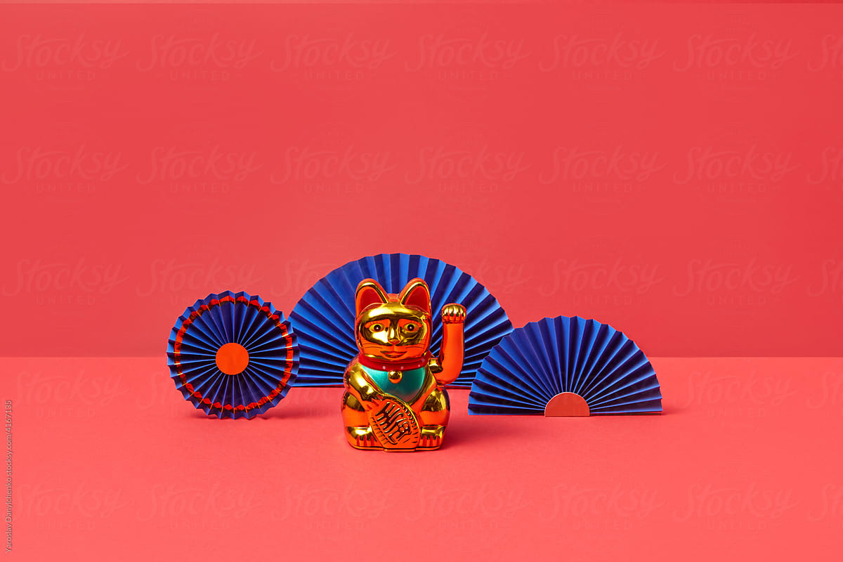 Asian waving cat and origami fans